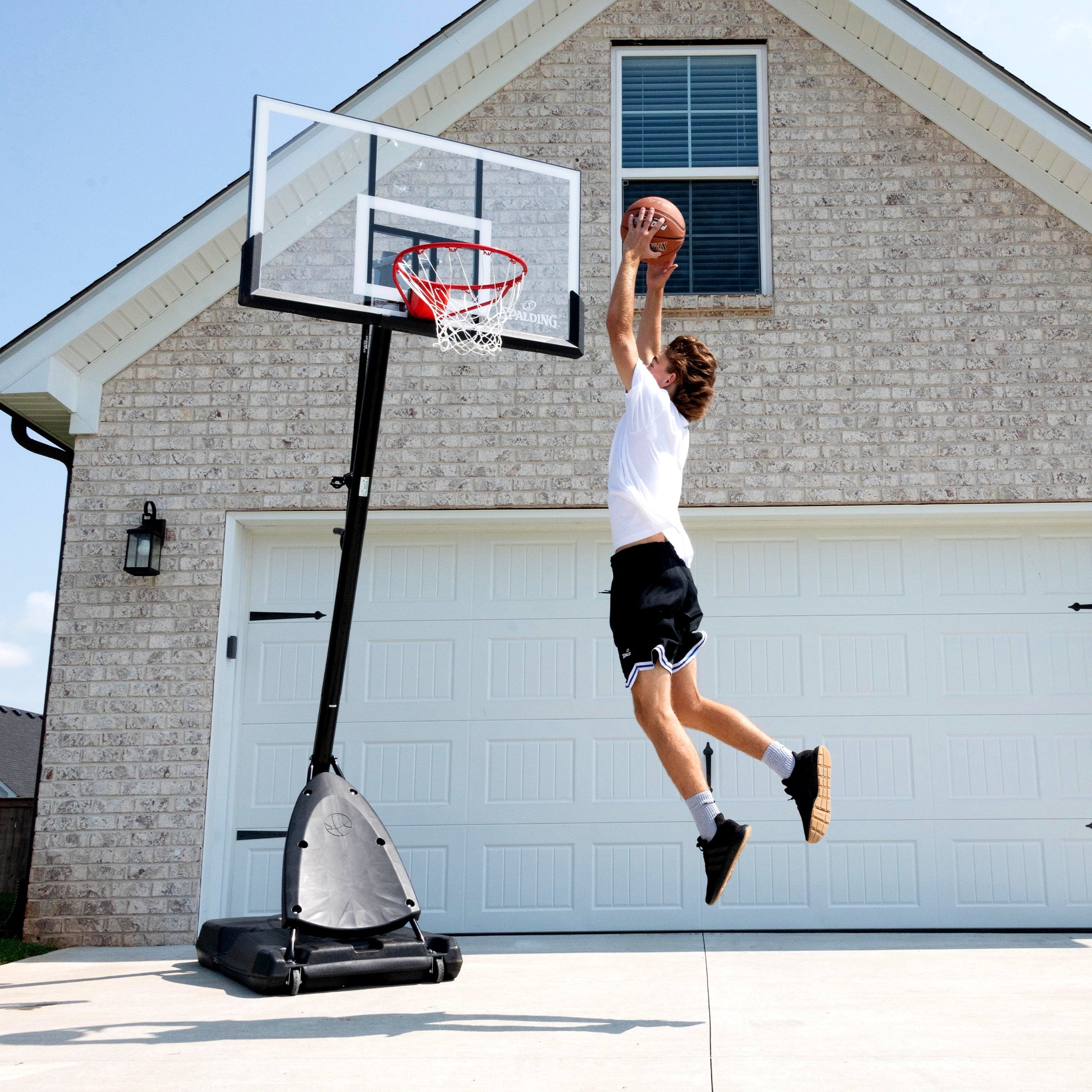2026 Spalding 54-Inch Portable Basketball Hoop with Shatter-Proof Polycarbonate Backboard, Adjustable ExactaHeight System & Pro Slam Rim-Outdoor Play