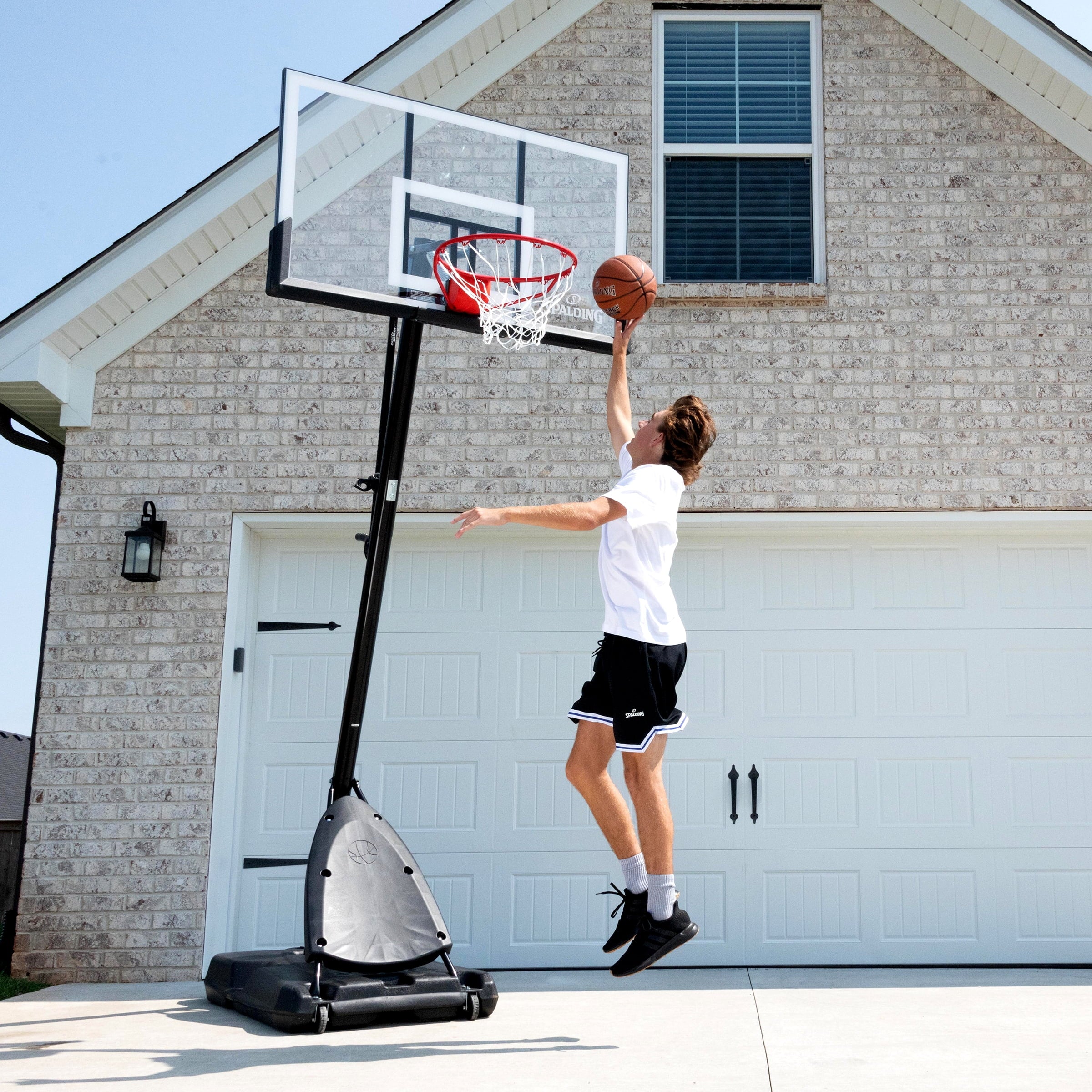 2026 Spalding 54-Inch Portable Basketball Hoop with Shatter-Proof Polycarbonate Backboard, Adjustable ExactaHeight System & Pro Slam Rim-Outdoor Play