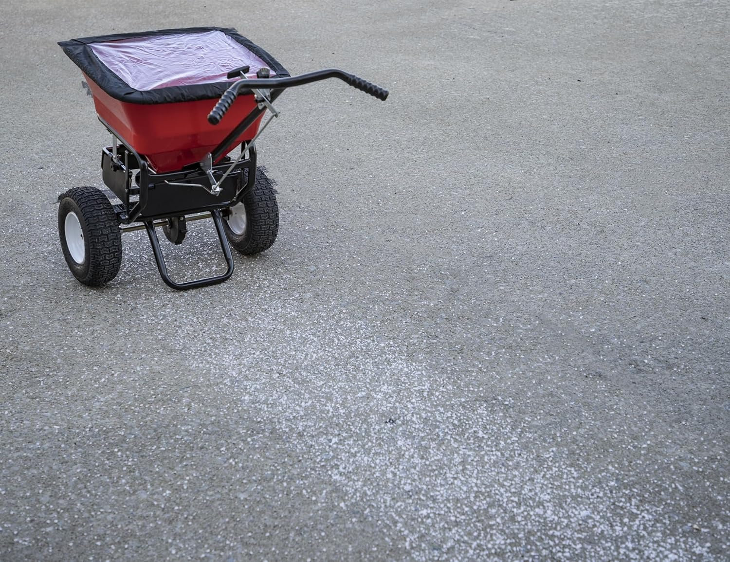 2026 Multi-purpose push-along spreader, 100 lb capacity, versatile tool for lawn seed, salt, de-icer, fertilizer and seeds
