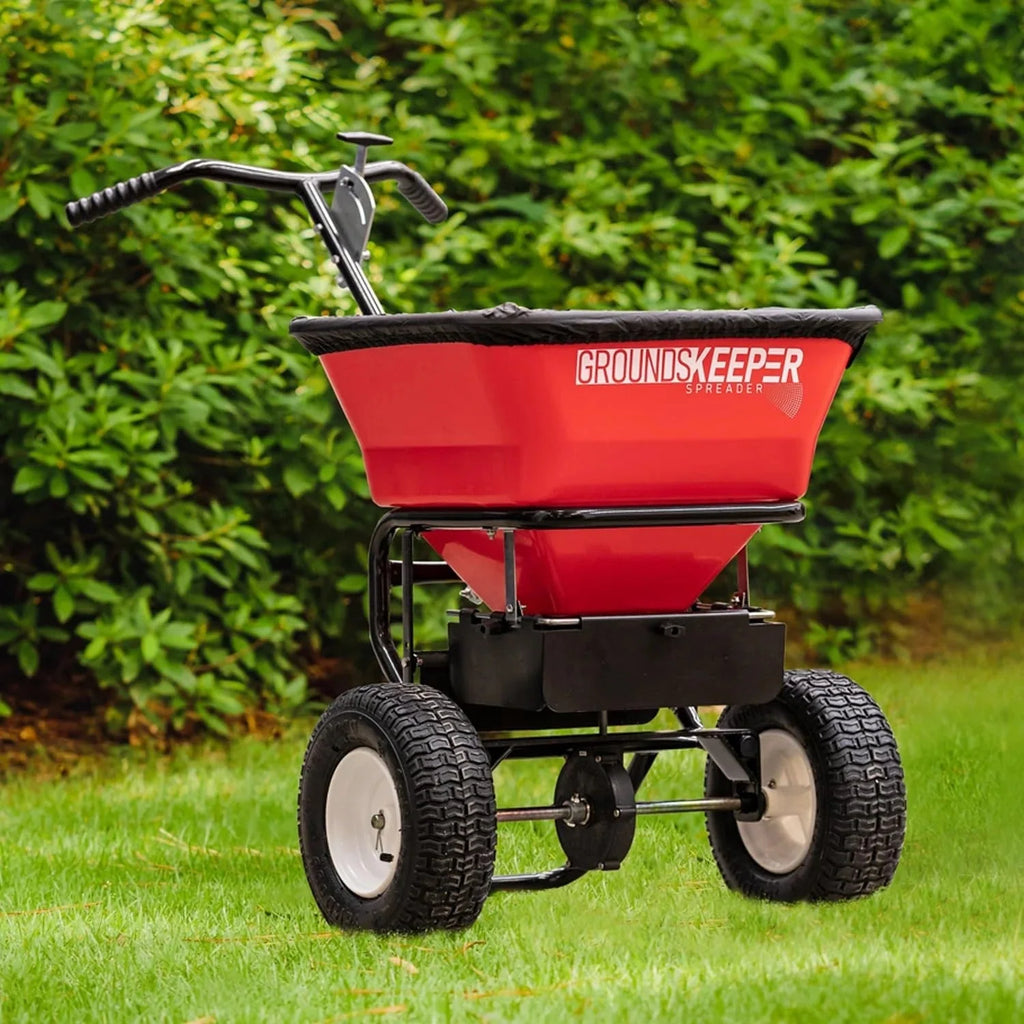 2026 Multi-purpose push-along spreader, 100 lb capacity, versatile tool for lawn seed, salt, de-icer, fertilizer and seeds